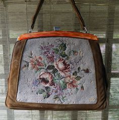 Beautiful petite point hand bag from 60's in good vintage condition 7/10 (in a few places the thread on the tapestry is missing) + color: brown leather + pattern: floral/tapestry + orange mother of pearl detail + metal buckle + light green lining dimensions 31 x 24cm handle 20 x 13cm Vintage Beige Satchel, Handmade Vintage Brown Bag, Vintage Brown Rectangular Bag, Vintage Handmade Tote Satchel, Vintage Handmade Satchel Tote, Vintage Beige Shoulder Bag With Handles, Formal Vintage Tapestry Bag, Vintage Formal Tapestry Bag, Vintage Embroidered Tapestry Shoulder Bag