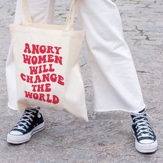 "Angry Women Will Change The World Tote Bag - Feminist Tote Bag, Aesthetic Tote Bag, Trendy Tote Bag, Tote Bag Aesthetic, Retro Tote Bag, Kidcore Aesthetic Laptop Bag, Flower Tote DETAILS ✦ Very lightweight and compact bag! ✦ Perfect for books, laptops, etc. ✦ Material: 100% cotton sheeting ✦ Measuring at 15.75\"h x 15.25\"w ✦ Short Handle Length: 21.5\" (54.61cm) ✦ Direct to garment printing - no vinyl, decal, or iron-on technique ✦ Please note that colors may appear different on different digi Trendy Letter Print Bags, Letter Print Bags For Shopping, Casual Bags Perfect For Gifts, Goth Punk Aesthetic, Feminist Merch, Feminist Tote Bag, Aesthetic Laptop, Angry Women, Kidcore Aesthetic