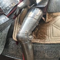 several different types of armor and helmets on display