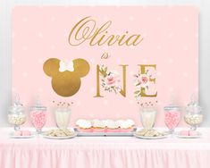 a minnie mouse birthday party with pink and gold decorations