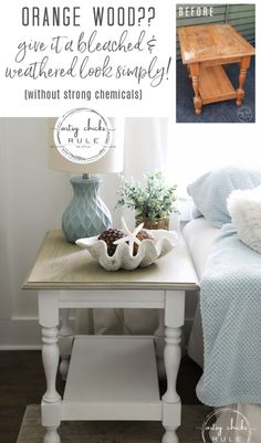 an orange wood table sitting on top of a wooden floor next to a white couch