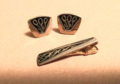 "Vintage men's jewelry set of cuff links and tie clip! Silver metal with scrolls on a black background, goes with so much! Circa 1960's or 70's and measures: Tie clip approx. 1 7/8\"; cuff link approx. 7/8\" at widest. No makers mark that we can see. Set is in good condition, please see all photos. Offbeat Avenue uses recycled packaging when avialable." Engraved Retro Jewelry For Formal Occasions, Vintage Engraved Jewelry For Business, Retro Black Jewelry For Formal Occasions, 70s Mens Fashion, Mens Fashion Suits, Suit Fashion, Cuff Links, Black And Silver, Men's Jewelry