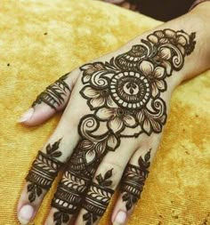 henna tattoo on the palm of someone's hand