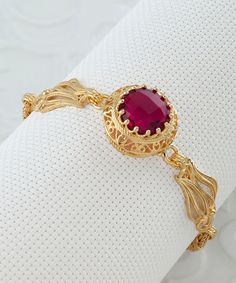 "Gold Ruby Vintage Silver Edwardian Bracelet, 925 Sterling Gold Plated Red Quartz Gemstone, Artisan Handmade Antique Filigree Bracelet Unique Women Jewelry, silver gift for her, victorian bracelet, wedding gift her, july birthstone, one of a kind, fuchsia bracelet Material: 925 Sterling Silver GOLD PLATED ( NICKEL FREE ) Gemstone: Ruby Quartz  12 mm. Ruby is the July birthstone - and it's one of the most coveted of gems. The name is derived from the Latin word ruber, meaning \"red\" - the color Filigree Round Bracelet For Anniversary, Elegant Red Bangle Gold Bracelet, Elegant Red Bracelet With Birthstone, Elegant Red Gold Bangle Bracelet, Elegant Red Birthstone Bracelet, Anniversary Filigree Round Bracelet, Elegant Red Gold Bracelet For Formal Occasions, Fine Jewelry Filigree Red Jewelry, Adjustable Elegant Ruby Bracelet