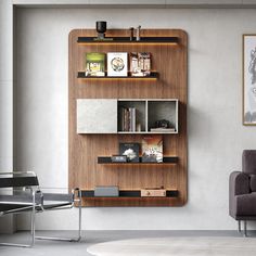 a living room filled with furniture next to a wall mounted book shelf on the side of a wall