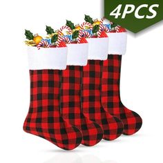 three christmas stockings with candy canes and holly on them, all in red and black plaid