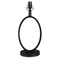 a black candle holder with an iron ring around it's base on a white background