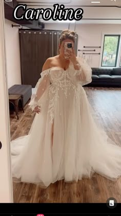 a woman taking a selfie in her wedding dress with the caption's name