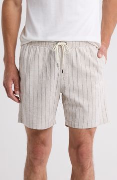 Lightweight cotton woven in pale stripes invites sunny-day comfort in shorts that tie at the waist and offer roomy pockets for holding essentials. 6" inseam; 22" leg opening; 11" front rise; 15" back rise (size Small) Elastic/drawstring waist Side-seam pockets; back flap-patch pocket 52% linen, 46% cotton, 2% elastane Machine wash, tumble dry Imported Striped Linen Shorts For Summer, Striped Linen Summer Shorts, Cotton Bottoms With Vertical Stripes For Vacation, White Vertical Striped Bottoms For Vacation, Relaxed Fit Bottoms With Vertical Stripes For Summer, White Vertical Striped Bottoms For Summer, Striped Cotton Bottoms For Summer, Summer Bottoms With Vertical Stripes In Short Length, White Bottoms With Vertical Stripes For Summer