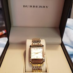 Burberry Woman's Watch In Gold With A Beige Face. Beautiful Watch In Excellent Condition, Has A New Battery, Comes In Original Box, Warranty Card Papers, Instruction Manual And Extra Link Pieces To Attach For The Perfect Size. Woman's Watch, Gold Watches Women, Burberry Accessories, Burberry Women, Instruction Manual, Beautiful Watches, Cream And Gold, Gold Watch, Accessories Watches