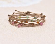 Say hello to our Riptide bracelet - all the drama of a stack in just one perfect bracelet. Like all your Tula Blue, Riptide bracelets are completely waterproof, perfect for those summer days that take you from the beach to the pool and back again. (Beach and pool not necessary for carefree summer vibes!) - 5 Tourmaline Stones, you pick! (5-6mm)- Signature Tula Blue hand-spun ROPE- 100% waterproof- Sliding knot closure for custom fit One more thing: Due to the one-of-a-kind nature of our material Sliding Knot Closure, Versatile Jewelry, Tourmaline Stone, Blue Hand, Sliding Knot, The Drama, Color Shapes, Green Tourmaline, Brand Ambassador