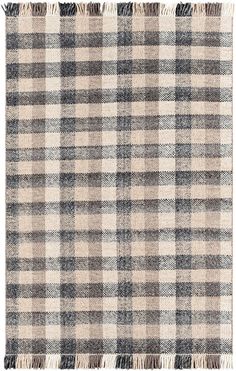 a plaid rug with fringes on the bottom and one side in grey, beige and white