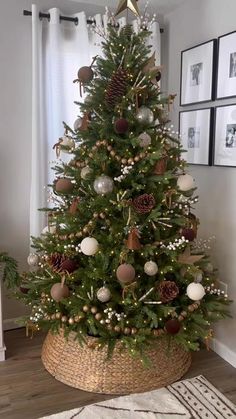 a christmas tree with ornaments in a basket