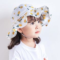 Delightful Summer Hat for Your Little Princess Introducing the Adorable Fruit Print Cotton Bucket Hat, a perfect blend of style, comfort, and protection for your baby girl. This charming hat, designed for toddlers aged 1-3 years, is an essential accessory for summer, autumn, and spring outings. Whether you are heading to the beach, a picnic, or just a stroll in the park, this hat will keep your little one looking cute and feeling comfortable. Charming Design and Comfortable Fit Our bucket hat features a delightful fruit print that adds a splash of fun to any outfit. Made from high-quality cotton, this hat is soft, breathable, and gentle on your baby's delicate skin. The hat circumference of 19.3-20 inches ensures a snug and secure fit, while the adjustable bow tie allows you to customize t Baby Summer Hat, Hat For Baby, Kids Bucket Hat, Cartoon Designs, Cotton Bucket Hat, Child Smile, Spring Wear, Family Picnic, Toddler Age