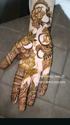 henna designs for hands and feet with flowers on the bottom half of the hand