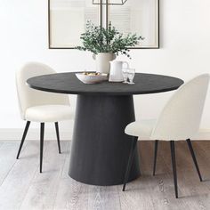 a black table with white chairs around it