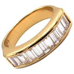 Gilberto Cassola 18Kt Yellow Gold Ring with Baguette Diamonds. Handmade in Italy in Our Athelier in Valenza (AL). 18Kt Gold g 8,20 F Color VVS Clarity Baguette Diamonds Total Weight ct 1.35 This Ring is a Regular Size 53 (EU) and can be delivered in any Size with no Additional Cost. A very Classy and Timeless Piece, Handcrafted with the Highest Italian Quality. Luxury Baguette Ring For Formal Occasions, Formal Baguette Channel Set Rings, Classic Gold Baguette Ring, Classic Baguette Rings For Formal Occasions, Classic Formal Baguette Rings, Classic Gold Baguette Diamond Ring, Classic Yellow Gold Baguette Ring, Gold Baguette Diamond Ring For Formal Occasions, Formal Gold Baguette Diamond Ring