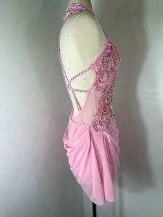 a pink dress on display in a room