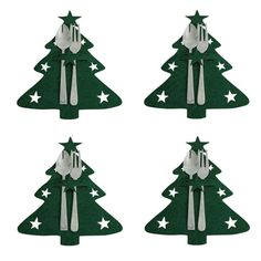 four christmas trees with forks and spoons on them