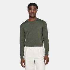 A simple luxury layer in a rich all-season shade, this dark green crewneck sweater is made for effortless luxurious layering. Green Crew Neck Sweater For Layering, Classic Green Workwear Sweater, Olive Crew Neck Sweater For Fall, Olive Long Sleeve Sweater For Layering, Green Crew Neck Sweater For Workwear, Green Tops For Business Casual In Fall, Green Business Casual Tops For Fall, Dark Green Crewneck, Green Crewneck