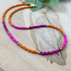 These delicate boho chic style necklace are great on their own or layered with other unique designs. Designed for everyday wear. T ♥ ITEM DETAILS: Total Length: Approx. 14 inches / 16 inches / 18 inches. The length of the necklace refers to the total length from end-to-end. Materials: Czech Glass Seed Beads. Color necklace available: Orange with Pink and gold. ♥ GIFT IT Jewelry comes in a cute Canva bag ready to gift! If you wish your item to be a gift, please let me know and I will include a cu Bohemian Necklace With Spacer Beads For Beach, Bohemian Beach Necklace With Spacer Beads, Bohemian Beaded Necklaces For Summer, Bohemian Beaded Summer Necklace, Summer Bohemian Beaded Necklaces, Summer Bohemian Beaded Necklace, Multi-strand Beaded Necklaces For Summer, Summer Multi-strand Colorful Beaded Necklaces, Summer Spacer Bead Choker Jewelry