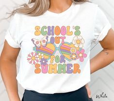 a woman wearing a t - shirt that says school's out for summer with sun glasses and flowers