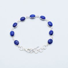 Natural Lapis Lazuli Bracelet, 925 Sterling Silver Lapis Lazuli Bracelet, Handmade Silver Gemstone Bracelet, Solid Silver Bracelet. Metal:- 925 Sterling Silver Gemstone:- Lapis Lazuli Stone Shape:- Oval Stone Size:- 7x9mm Bracelet Length:- 8 inch including 4 extenders. The Bracelet is stamped 925. About Gemstone:- Variously described as indigo, royal, midnight, or marine blue, lapis lazuli's signature hue is slightly greenish blue to violetish blue, medium to dark in tone, and highly saturated. Elegant Lapis Lazuli Oval Cabochon Jewelry, Elegant Oval Cabochon Lapis Lazuli Jewelry, Oval Blue Gemstone Bracelets, Sapphire Sterling Silver Bracelets Gift, Sapphire Sterling Silver Bracelet Gift, Blue Oval Sterling Silver Bracelet Gift, Oval Blue Sterling Silver Bracelet As Gift, Sapphire Sterling Silver Bracelet For Gift, Oval Blue Sterling Silver Bracelet Gift