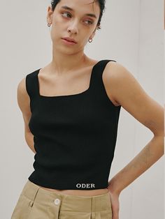 This is ODER’s sleek sleeveless knit top, tailored for a refined look. With its stretchy fabric, it offers comfortable wear, making it perfect for standalone styling with its basic design.- Perfect for daily wear, providing both comfort and style- Ideal for pairing with different styles of bottoms- Its clean style effortlessly complements any look- The brand logo embroidered at the bottom front adds a subtle touch of sophistication Chic Seamless Tops For Work, Modern Sleeveless Elastane Top, Elegant Black Sleeveless Knit Top, Everyday Sleeveless Tops With Minimal Stretch, Modern Stretch Tank Top For Work, Elegant Fitted Sleeveless Knit Top, Summer Workwear Seamless Tops, Seamless Summer Tops For Work, Sleek Sleeveless Elastane Tops