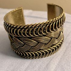 Braided Gold Tone Design Cuff Bracelet, Excellent Condition With Original Price Tags Still On Trendy Metal Cuff Bracelet, Metal Cuff Bracelet As Fashion Accessory, Trendy Metal Cuff Bracelet For Festivals, Adjustable Metal Braided Bangle Bracelet, Adjustable Metal Bracelets For Fashion, Metal Braided Bangle Bracelets, Trendy Adjustable Metal Cuff Bracelet, Bohemian Metal Cuff Bracelet For Parties, Adjustable Metal Cuff Bracelet For Festivals