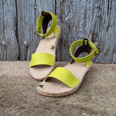 Espadrille sandal with wide ankle strap. Boho style. On semi-flat sole. Made of leather and interior lined with double leather. The sole is made of natural jute, back height 3cm, front height 1.5cm It has straight lines on the strap in front of the foot, and a 2.5 cm wide strap on the ankle bracelet, with a round buckle. Made of pistachio green leather. Ask us about availability of other colors. You are going to choose sandals designed, patterned and manufactured in my Artisan Workshop for you, Spring Green Sandals With Woven Sole, Green Open Toe Sandals With Woven Sole, Green Open Heel Sandals With Rubber Sole, Green Closed Toe Espadrilles For Beach, Summer Ankle Strap Espadrilles In Natural, Summer Natural Ankle Strap Espadrilles, Green Ankle Strap Sandals With Removable Insole, Green Espadrilles For Summer, Green Sandals With Leather Sole For Summer