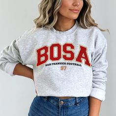 Perfect sweatshirt for Nick Bosa and San Francisco football fans this season! Ideal for any situation, a unisex heavy blend crewneck sweatshirt is pure comfort. These garments are made from polyester and cotton. This combination helps designs come out looking fresh and beautiful. The collar is ribbed knit, so it retains its shape even after washing. There are no itchy side seams on these sweaters.  .: 50% cotton, 50% polyester .: Medium-heavy fabric (8.0 oz/yd² (271.25 g/m .: Loose fit .: Sewn-in label .: Runs true to size CARE INSTRUCTIONS: -Please wash all clothing items INSIDE OUT to preserve the design. -Please wash all clothing items on cold, and dry on Medium- low heat. -DO NOT IRON. -DO NOT TIE DYE. **Please check our color and size charts before you place your order. If you have an Fleece Sweatshirt Fan Apparel, Sporty Fleece Sweatshirt For Fans, Fleece Tops With Letter Print For Fans, Fan Apparel Crew Neck Hoodie, Collegiate Style Crew Sweatshirt With Screen Print, Collegiate Crew Sweatshirt With Screen Print, College Fan Apparel Crew Hoodie, College Crew Neck Fan Apparel Hoodie, Fleece Fan Apparel Sweatshirt