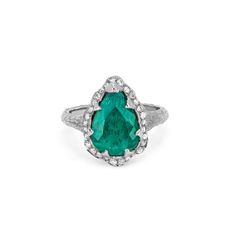 18k gold ring with a one-of-a-kind pear shaped Colombian Emerald center stone, surrounded by a full halo of white pavé diamonds. 0.22 total diamond carat weight. The one-of-a-kind Colombian Emerald center stone weight ranges from 3 - 3.50 carat weight. Luxury Teardrop Rings With Halo Setting, Luxury Teardrop Halo Setting Ring, Teardrop Diamond Halo Ring, Pear-shaped Diamond Halo Ring, Queen Rings, Columbian Emeralds, Colombian Emeralds, 18k Gold Ring, Diamond Carat