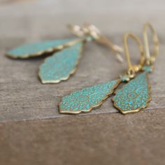 "These casual little earrings are perfect for every day. They are brass/gold with a greenish turquoise patina finish. The pair dangle from 14k gold filled ear wire that comes in two different styles... lever back or ball & hook. (pictured above) The earrings dangle at a total of 45mm (1 3/4\"). If you have any questions please do not hesitate to contact me. ALSO AVAILABLE IN SILVER... https://www.etsy.com/listing/214313768/dangling-silver-earrings-sterling-silver?ref=shop_home_active_15 GOLD Turquoise Teardrop Jewelry With Matching Earrings, Turquoise Teardrop Jewelry Set, Turquoise Teardrop Jewelry For Pierced Ears, Pierced Turquoise Teardrop Jewelry, Turquoise Teardrop Pierced Earrings, Turquoise Teardrop Pierced Jewelry, Elegant Turquoise Brass Jewelry, Turquoise Dainty Jewelry With Earrings Set, Elegant Handmade Turquoise Teardrop Earrings