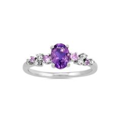 This sterling silver ring features a natural amethyst gemstone at its center for a pretty pop of color. Staggered natural amethyst and diamond accents create a floral look. Elegant Purple Birthstone Ring With Gemstone Accents, Purple Multi-stone Amethyst Ring, Oval Purple Diamond Ring With Gemstone Accents, Fine Jewelry Purple Rings With Diamond Accents, Purple Multi-stone Amethyst Ring Fine Jewelry, Fine Jewelry Purple Amethyst Multi-stone Ring, Purple Multi-stone Amethyst Ring In Fine Jewelry Style, Purple Birthstone Ring With Gemstone Accents, Purple Rings With Gemstone Accents