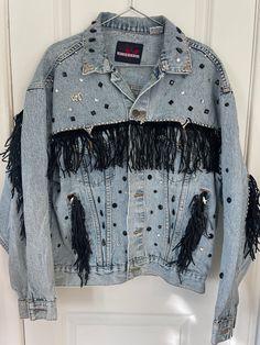 Denim and Leather Fringe Beweled Jacket with Silver Accents  Brand: Wingars Size: Large Condition: Great Fall Denim Jacket With Beaded Fringe And Long Sleeves, Embellished Denim Jacket For Fall, Trendy Beaded Fringe Fall Outerwear, Winter Embellished Denim Jacket, Denim Outerwear With Rhinestone Fringe For Fall, Fall Denim Outerwear With Rhinestone Fringe, Winter Denim Jacket With Rhinestone Fringe And Long Sleeves, Casual Denim Jacket With Rhinestone Fringe For Fall, Embellished Denim Outerwear For Festivals