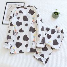 The Cartoon Cow Original Pajamas is a great fun and stylish pajama set. This set is made out of quality materials, ensuring you experience a soft and comfy feel while sleeping. We are passionate about fabric and textile materials and have thus created the best, most comfortable yet practical line of pajamas. This loungewear is all you need to help relax at home. They are soft and easy to touch which projects versatility and effortless grace in every step you take. Made to make you feel good, eac Lounging Outfit, Stylish Pajamas, Cartoon Cow, The Cartoon, Every Step You Take, Knitting Materials, Stretchy Material, Making Out, Pajama Set