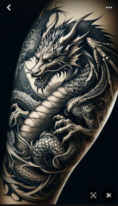 a black and white photo of a dragon tattoo