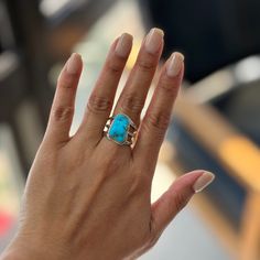 "Turquoise Stone and Sterling Silver Ring Natural Freeform Turquoise Gemstone Sterling Silver Ring A beautiful turquoise stone set on a three-strand band, that gives the appearance of stackable rings to see a  dainty peek at your finger. The smooth combined with the rope texture band and beautiful stone create a one-of-a-kind handcrafted ring. DETAILS  Meticulously Handcrafted Turquoise free-form stone Size 7  Face dimensions: approximately 1/2\" x 3/4\" PACKAGING Each piece comes packaged in a Bohemian Turquoise Rings With Gemstone Accents, Turquoise Bohemian Rings With Gemstone Accents, Artisan Turquoise Jewelry For Anniversary, Artisan Multi-stone Turquoise Ring, Fine Jewelry Turquoise Gemstone, Turquoise Gemstone Fine Jewelry, Unique Turquoise Jewelry For Anniversary, Elegant Blue Larimar Turquoise Ring, Adjustable Turquoise Ring Fine Jewelry