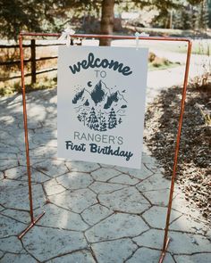 a welcome sign for ranger's first birthday in front of a fenced area