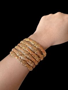 This beautiful set of six gold-plated bangles are perfect for any occasion! Their size of 2.6 inches make them the perfect accessory for any look. Whether you're gifting them to a loved one or keeping them for yourself, these bangles will add a touch of sparkle to any outfit. Ready to ship for instant statement-making! Features: Entirely unique set of four bangles with genuine gold plating Dynamic and interesting jewelry set Can be worn together or pieced with other bracelets Perfect for a night Traditional Rose Gold Bangle Bracelets, Traditional Rose Gold Bangle Bracelet, Traditional Rose Gold Bangle As Gift, Gold Stackable Bangle For Festivals, Traditional Gold Stackable Bangle, Gold Stackable Bangle For Weddings, Festive Gold Stackable Bangle, Stylish Bangles, Interesting Jewelry