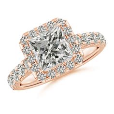 an engagement ring with a princess cut diamond in the center and pave set shoulders