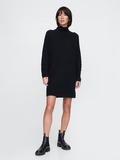 Supersoft cotton-blend mini sweater dress.  Turtleneck.  Long sleeves.  Fit: Over Sweater Dress Black, Plush Yarn, Mini Sweater, Black Sweater Dress, Everyday Luxury, Ribbed Turtleneck, Everyday Luxuries, Mini Sweater Dress, Toddler Gifts