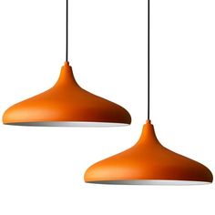 two orange lamps hanging from the ceiling