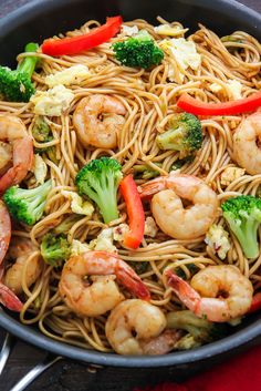 shrimp, broccoli and bell pepper noodles in a skillet