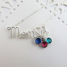 Shop: www.deannewatsonjewelry.etsy.com Show your mom how much you appreciate her with a custom birthstone necklace. This necklace is a great idea for grandmothers too! Hand wire wrapped pendant in sterling filled silver with dainty sterling silver chain. Birthstone charms are perfect for moms and grandmothers - just add a crystal for each child. * Choose from 0-4 crystals from the drop down menu.  Sterling silver plated or gold plated Swarovski crystal birthstone charms (See photo 3) - Remember Custom Name Birthstone Necklace For Mother's Day, Mother's Day Custom Name Sterling Silver Birthstone Necklace, Mother's Day Sterling Silver Birthstone Necklace With Custom Name, Handmade Birthstone Necklace For Anniversary, Mother's Day, Customizable Sterling Silver Birthstone Necklace For Mom, Sterling Silver Birthstone Necklace With Custom Name For Mom, Adjustable Nickel Free Birthstone Necklace For Mother's Day, Sterling Silver Birthstone Necklace For Mom, Word Jewelry