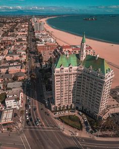 an aerial view of the beach and buildings