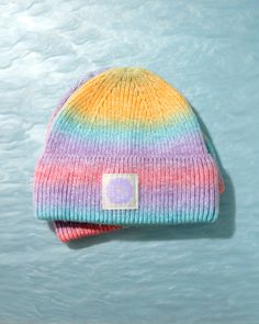 Brighten up chilly days with Daily Disco's Rainbow Ombre Beanie! This vibrant, eye-catching beanie features a seamless blend of rainbow colors, making each piece uniquely different. Crafted from a cozy and durable cotton-acrylic blend, it offers both comfort and style for any winter ensemble. The ombre effect of the yarn ensures that no two beanies are exactly alike. Get ready to turn heads and brighten moods with this delightful addition to your winter wardrobe! Trendy Multicolor Fall Hat, Multicolor Beanie For Outdoor, Trendy Multicolor Winter Beanie, Multicolor Casual Fall Hats, Casual Multicolor Fall Hat, Multicolor Beanie Cap, One Size Fits Most, Multicolor Beanie Cap One Size Fits Most, Multicolor One Size Beanie For Outdoor, Multicolor One-size Beanie For Outdoor