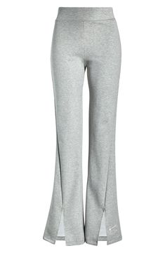 Sporty Flared Bottoms For Loungewear, Sporty Solid Color Flare Pants, Sporty Flare Lounge Pants, High-cut Leg Elastane Pants For Athleisure, Sporty Flare Pants For Loungewear, Stretch Flare Activewear For Spring, Spring Stretch Flare Activewear, Spring Flare Stretch Activewear, Stretch Flare Cotton Yoga Pants