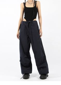 There’s a new trend in town, and it’s nightcity clothing’s Button Pocket Oversized Parachute Pants. These comfy, lightweight pants look great when paired with a crop top or graphic tee and sneakers. With a drawstring waistline, these pants are comfortable and secure, and the oversized fit gives them an effortless and chill look. Add these pants to your wardrobe, and you’ll never have a dull moment — you’ll always be ready for an impromptu night out, no matter how casual it might be.
Gender: Wome Urban Wide Leg Parachute Pants For Spring, Spring Urban Ankle-length Parachute Pants, Chic High Waist Parachute Pants For Streetwear, Cargo Pocket Bottoms For Night Out In Spring, Chic Wide-leg Streetwear Pants, Chic Wide-leg Pants For Streetwear, Wide-leg Pants For Summer Streetwear, Urban High Waist Parachute Pants For Summer, Urban High-waist Parachute Pants For Summer