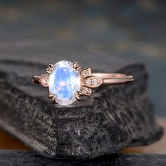 "Oval Cut Moonstone Engagement Ring Rose Gold Vine Leaf Three Stone Bridal Wedding Women Antique Ring Anniversary Birthstone June Rainbow Same Design with different gemstone: https://www.etsy.com/listing/628098692 https://www.etsy.com/listing/628231157 Interested in bridal set, check here: https://www.etsy.com/listing/731143644 ITEM INFORMATION Metal Type - Solid 14k Rose Gold Band Width - (approx. 1.5mm) Center Stone - 6*8mm Natural Moonstone, Oval Cut Side Stone - Natural Diamond Weight - 0.1m Moonstone Engagement Ring Rose Gold, Blue Topaz Engagement Ring, Wedding Women, Moissanite Bridal Sets, Engagement Ring Rose Gold, Moonstone Engagement, Topaz Engagement Ring, Moonstone Engagement Ring, Sapphire Wedding